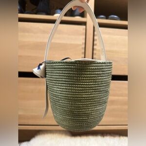 Green woven basket purse with leather details